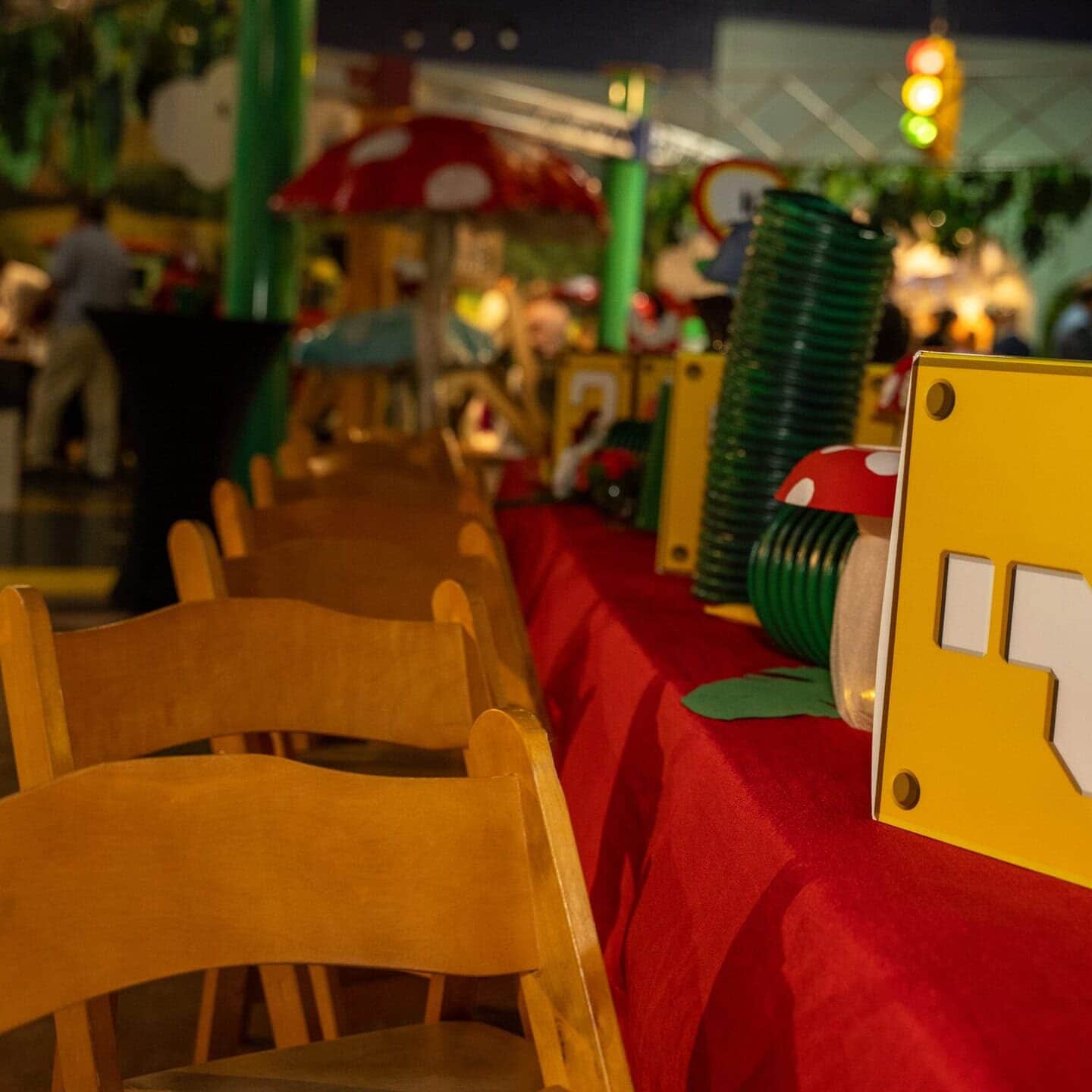 Children's museum gala setup with colorful decorations and tables for kids.